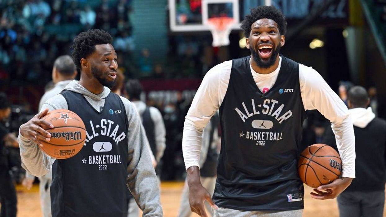 Andrew Wiggins, #22, and Joel Embiid, #21 of Team Durant, joke during the NBA All-Star practice at the Wolstein Center on Feb. 19, 2022, in Cleveland, Ohio.