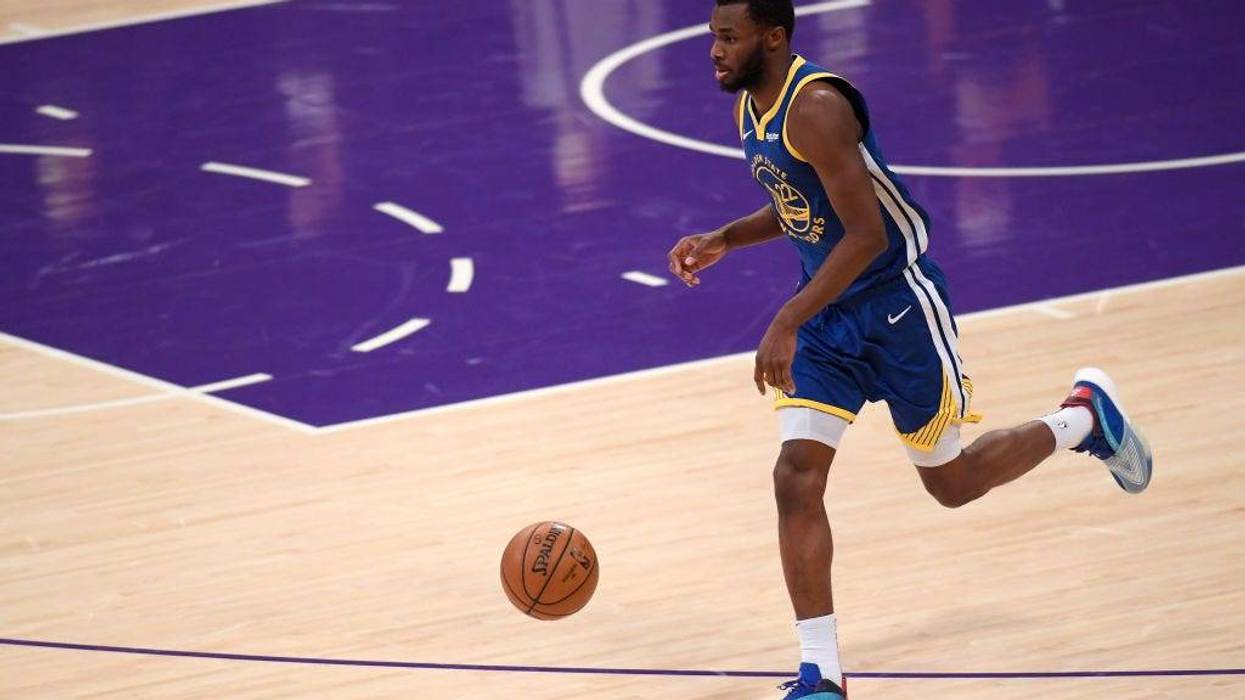 Andrew Wiggins #22 of the Golden State Warriors brings the ball up court during a 115-113 Warrior win over the Los Angeles Lakers on Martin Luther King Jr. Day at Staples Center on January 18, 2021 in Los Angeles, California.