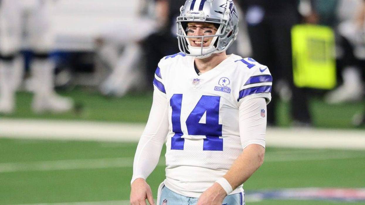 Andy Dalton #14 of the Dallas Cowboys reacts in the second half against the Philadelphia Eagles at AT&T Stadium on December 27, 2020