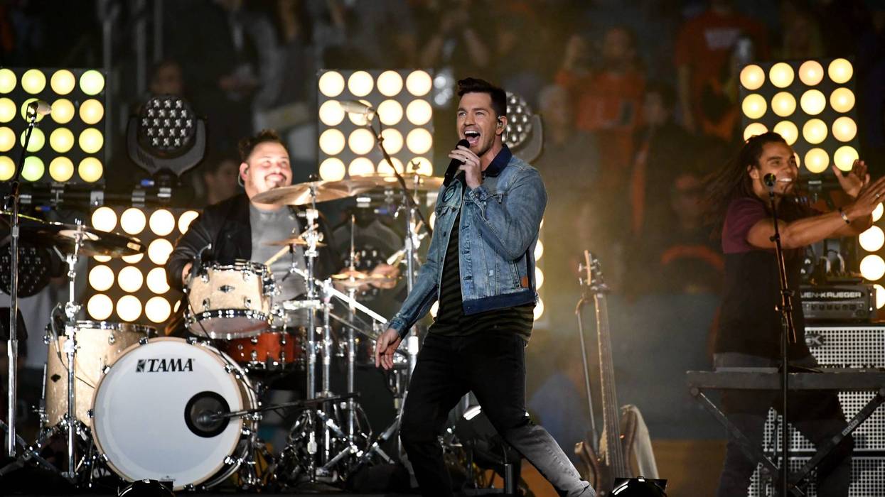 Andy Grammer performs on stage.