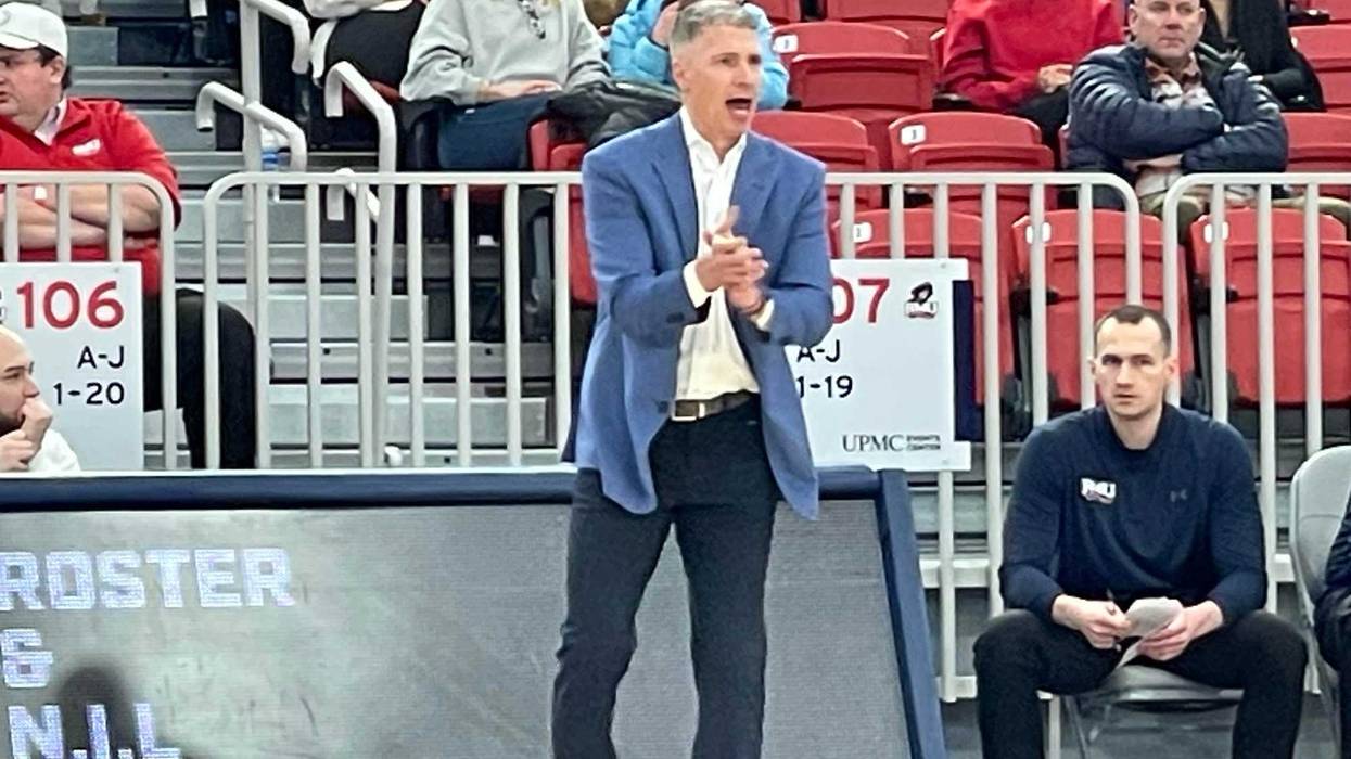 Andy Toole clapping on sideline