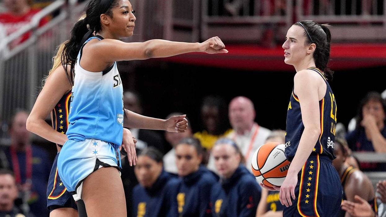 Angel Reese, left, reacts after getting called for fouling Caitlin Clark, right, during the second half of the Chicago Sky's game against the Indiana Fever on June 16, 2024.