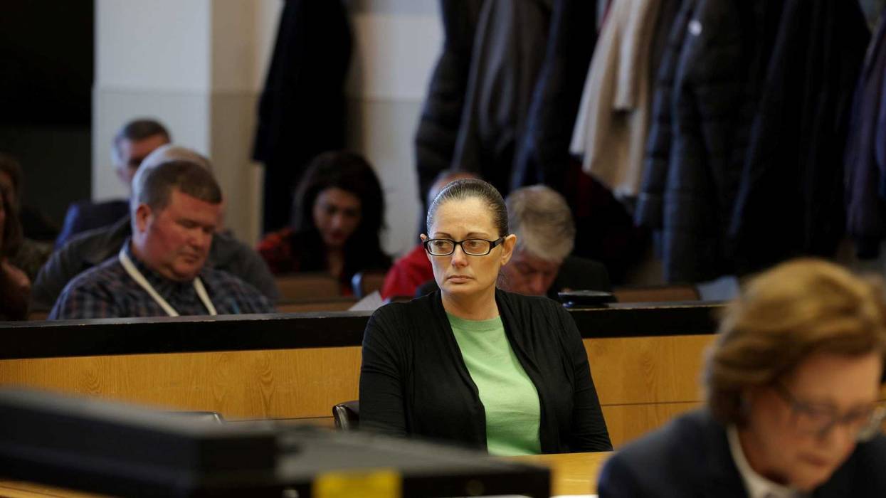Angela Pollina, a defendant in a murder trial held in a courtroom at Suffolk County Court in Riverhead, New York, listens to closing arguments by her attorney Matt Tuohy, on March 9, 2023.