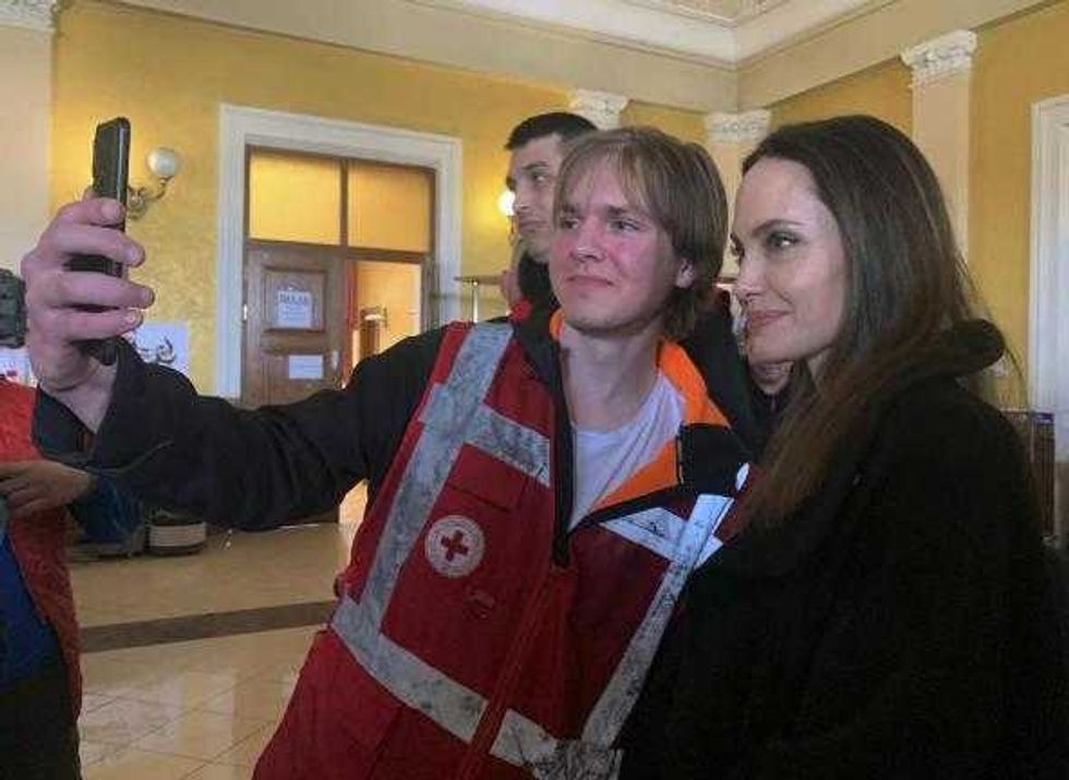 Angelina Jolie, Hollywood movie star and UNHCR goodwill ambassador, poses for photo with her fans in Lviv, Ukraine, Saturday, April 30, 2022. Ms Jolie was in Ukraine to meet the children affected by the war and visited hospitals and NGOs helping the injured and displaced.