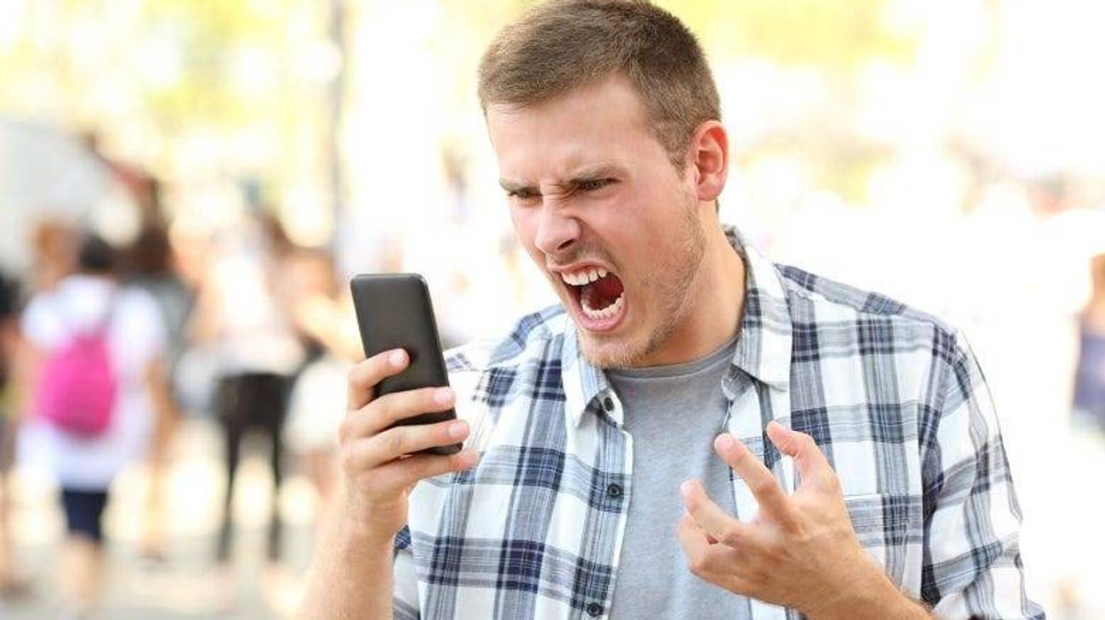 angry man answering cellphone