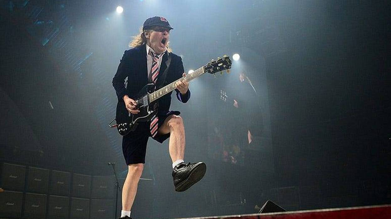 Angus Young performs with AC/DC