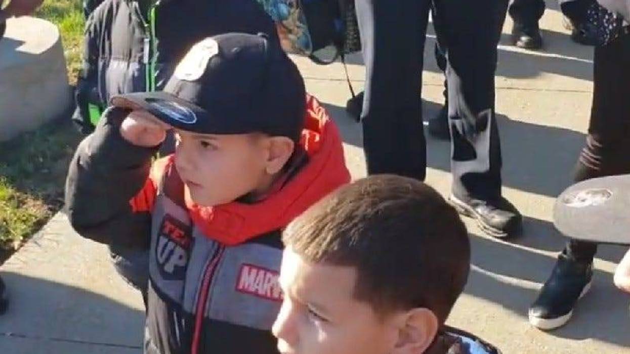 Aniel Mendez saluting officers