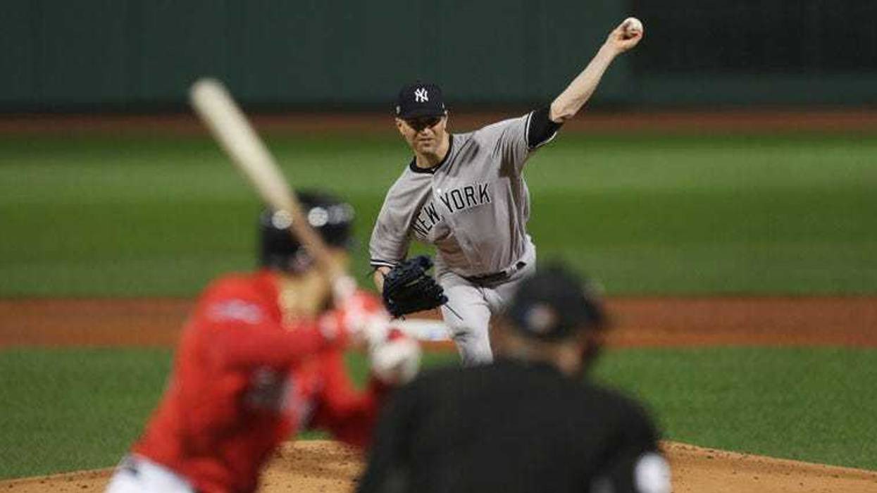 ankees starting pitcher J.A. Happ (34) throws the ball during the first inning against the Boston Red Sox in game one of the ALDS at Fenway Park.