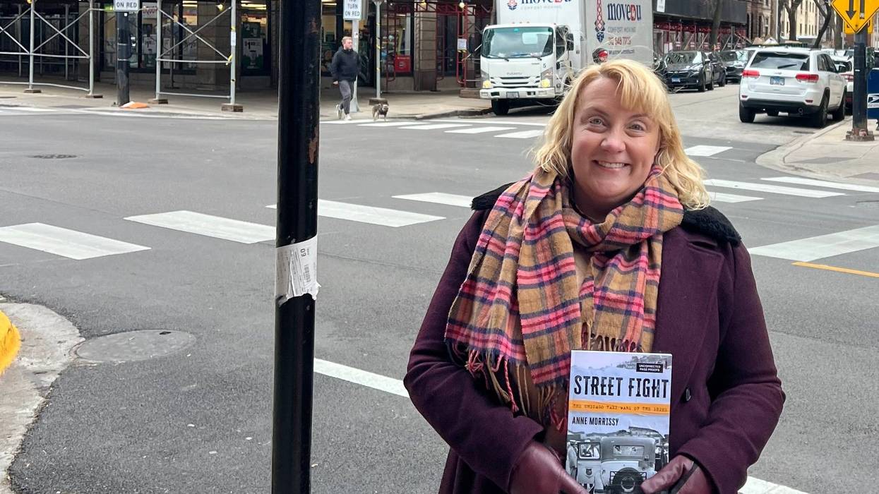Anne Morrissy with her book "Street Fight: The Chicago Taxi Wars of the 1920s."