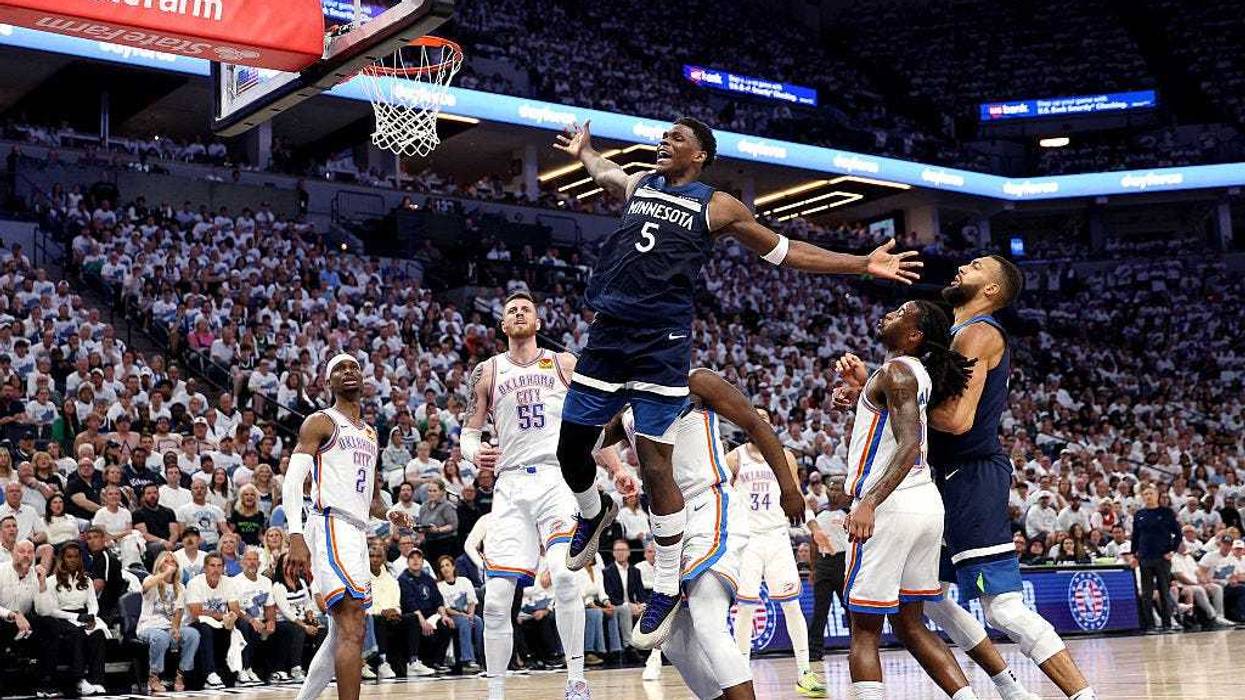 Anthony Edwards #5 of the Minnesota Timberwolves reacts to a foul against Cason Wallace #22 of the Oklahoma City Thunder during the second quarter in Game Four of the Western Conference Finals of the 2025 NBA Playoffs at Target Center on May 26, 2025 in Minneapolis, Minnesota.