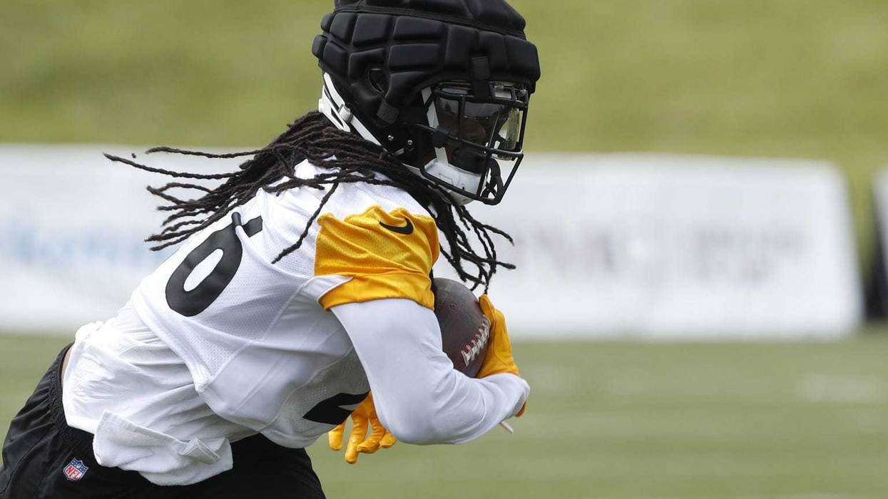 Anthony McFarland carrying football