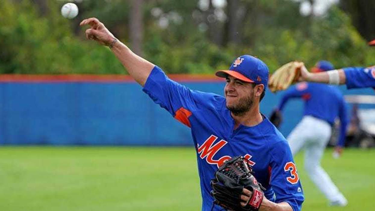 Anthony Swarzak warms up at practice on Feb. 14, 2018, in Port St. Lucie, Florida.