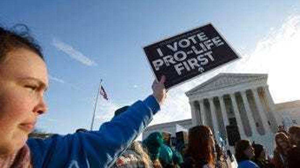 Anti-abortion demonstrators rally outside of the U.S. Supreme Court in Washington, Wednesday, March 4, 2020. (AP Photo/Jose Luis Magana)