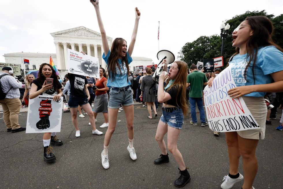 Anti-abortion right activists react to the Dobbs v Jackson Women
