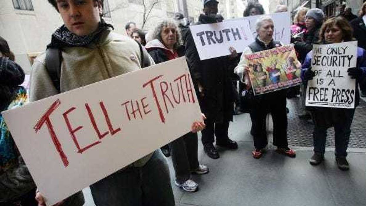 Antiwar protesters stand outside NBC headquarters to protest mainstream media's war coverage March 15, 2006 in New York City.