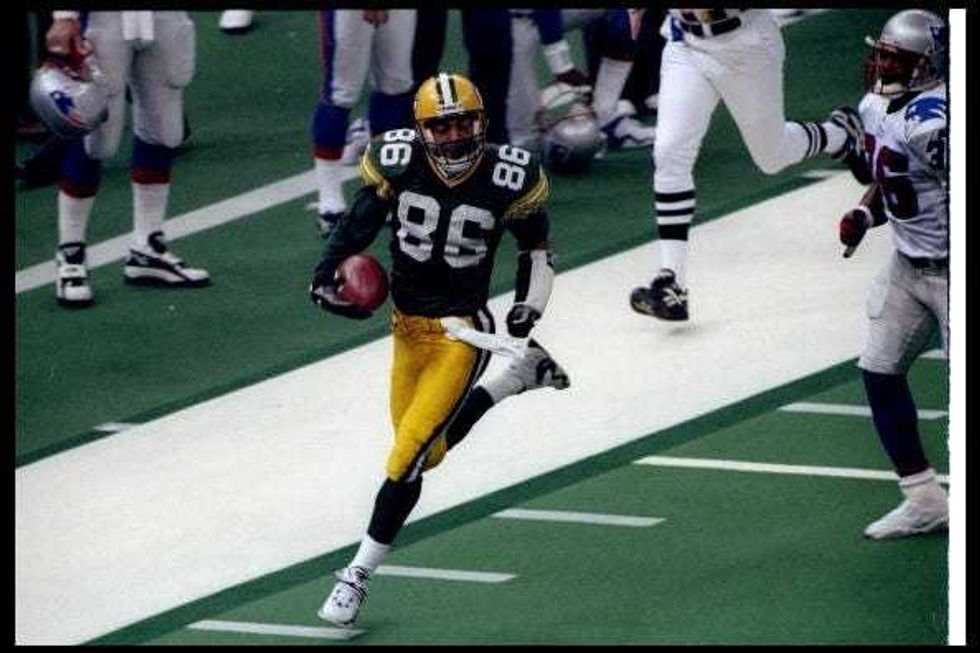 Antonio Freeman scores a TD in the Super Bowl