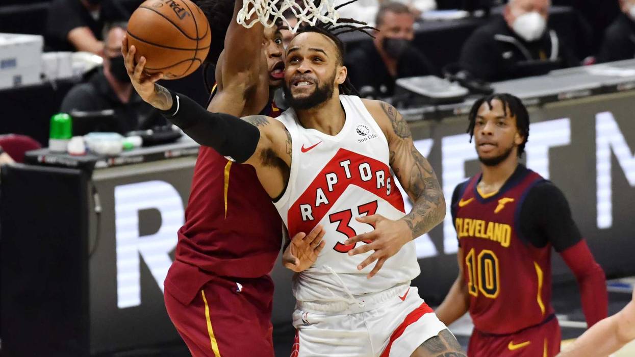 Apr 10, 2021; Cleveland, Ohio, USA; Toronto Raptors guard Gary Trent Jr. (33) drives to the basket against Cleveland Cavaliers guard Collin Sexton (2) during the fourth quarter at Rocket Mortgage FieldHouse.