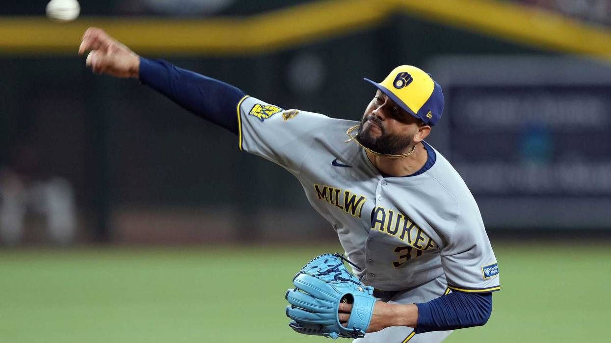 Apr 12, 2025; Phoenix, Arizona, USA; Milwaukee Brewers pitcher Joel Payamps (31) pitches against the Arizona Diamondbacks during the ninth inning at Chase Field. Mandatory Credit: Joe Camporeale-Imagn Images