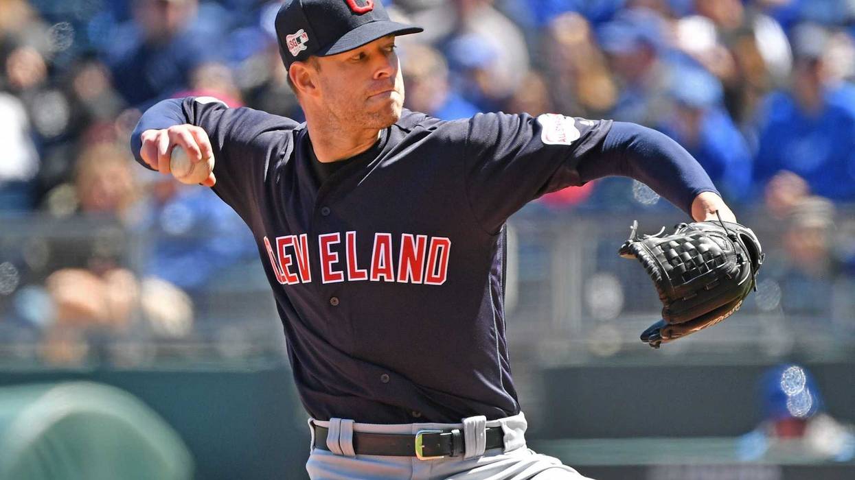 Apr 14, 2019; Kansas City, MO, USA; Cleveland Indians starting pitcher Corey Kluber (28) delivers a pitch during the first inning against the Kansas City Royals at Kauffman Stadium. Mandatory Credit: Peter G. Aiken/USA TODAY Sports