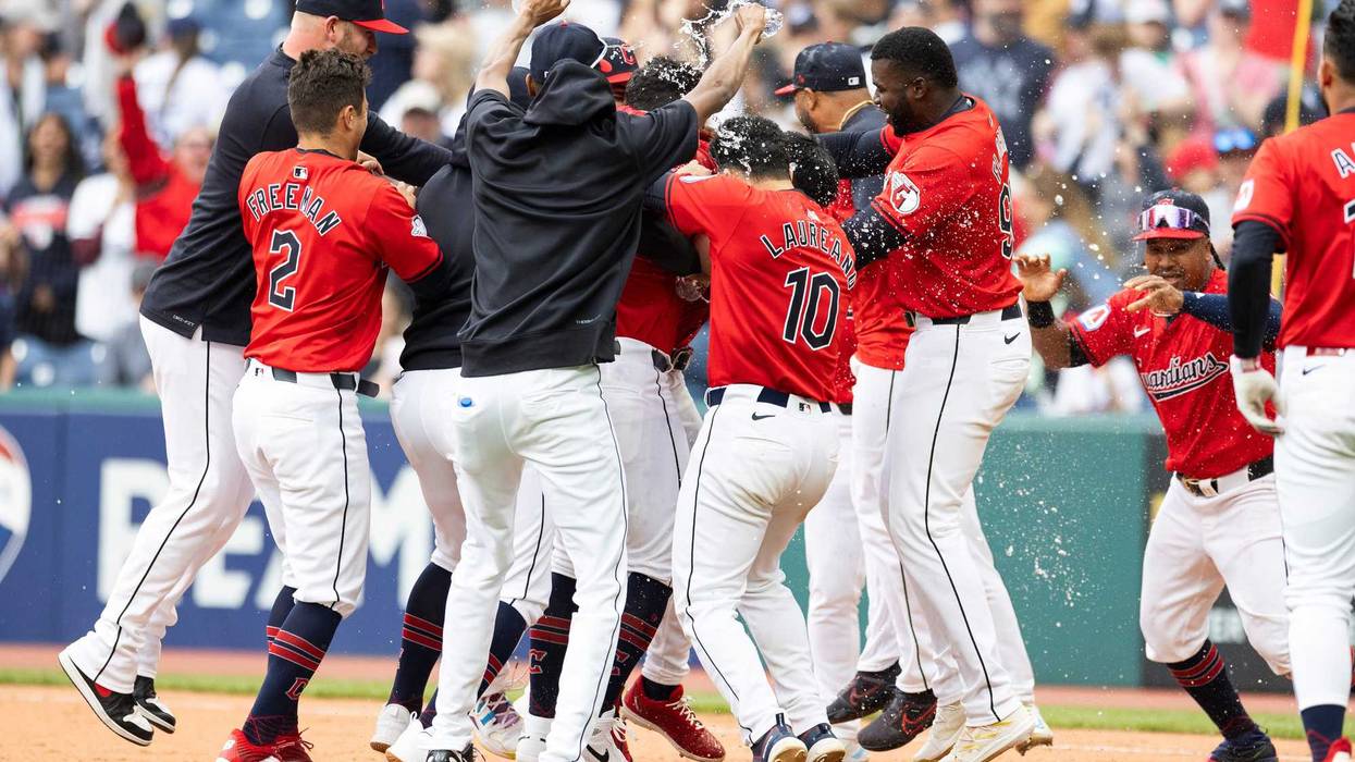 Apr 14, 2024; Cleveland, Ohio, USA; The Cleveland Guardians celebrate their tenth inning winning against the New York Yankees at Progressive Field.