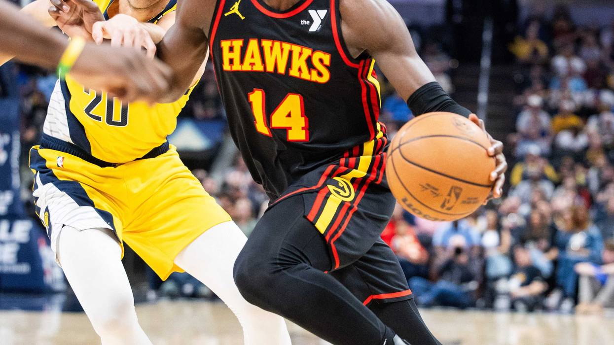 Apr 14, 2024; Indianapolis, Indiana, USA; Atlanta Hawks forward AJ Griffin (14) dribbles the ball while Indiana Pacers forward Doug McDermott (20) defends in the second half at Gainbridge Fieldhouse. Mandatory Credit: Trevor Ruszkowski-USA TODAY Sports