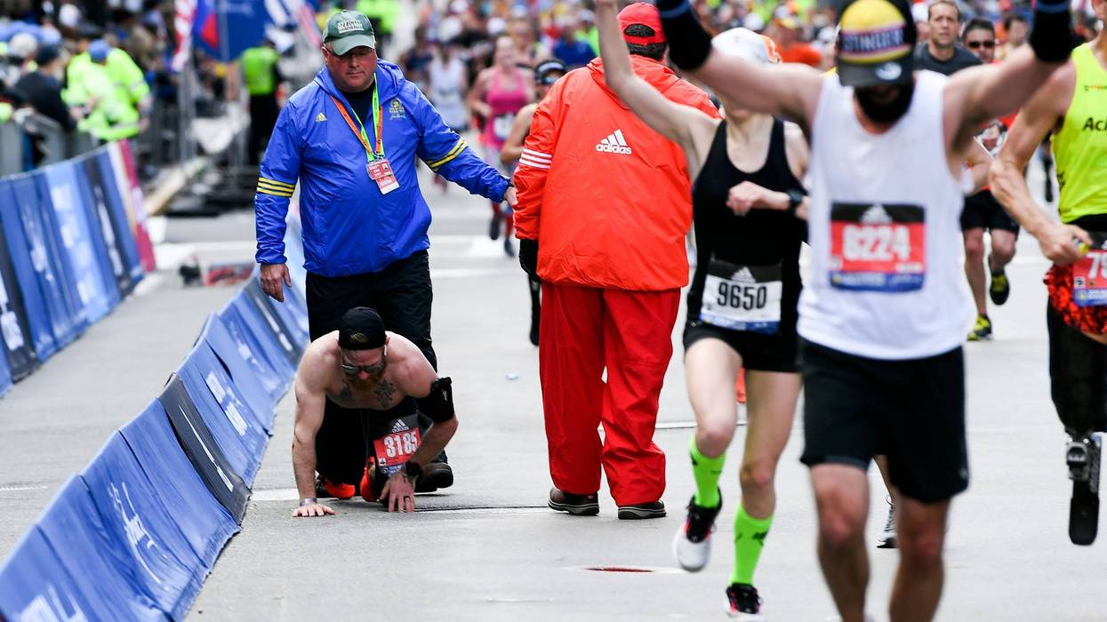 Apr 15, 2019; Boston, MA, USA; Micah Herndon crawls to the finish line of the 2019 Boston Marathon.