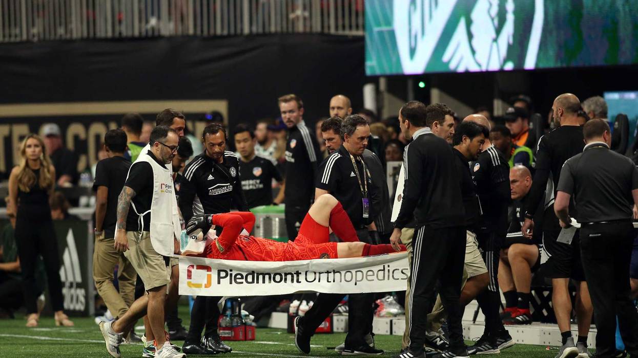 Apr 16, 2022; Atlanta, Georgia, USA; Atlanta United goalkeeper Brad Guzan (1) is helped off the field in a stretcher in the second half against the FC Cincinnati at Mercedes-Benz Stadium. Brett Davis-USA TODAY Sports