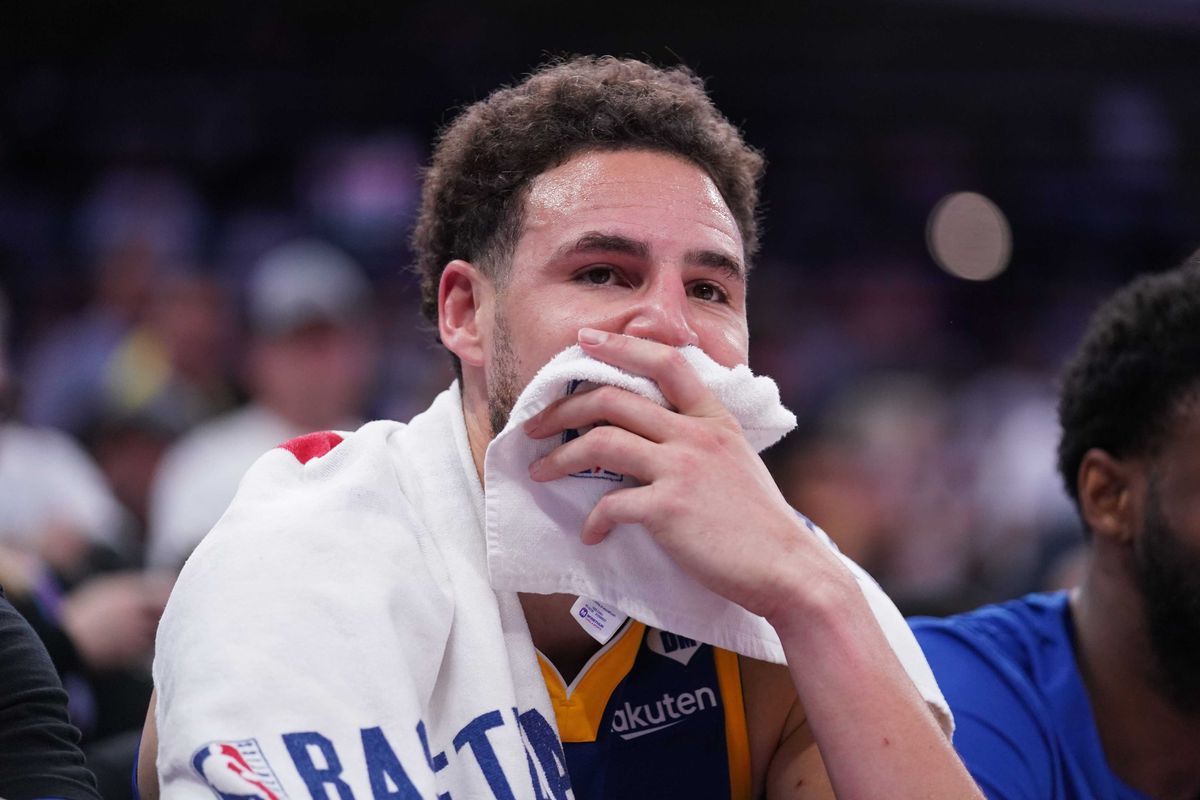Apr 16, 2024; Sacramento, California, USA; Golden State Warriors guard Klay Thompson (11) sits on the bench during action against the Sacramento Kings in the fourth quarter during a play-in game of the 2024 NBA playoffs at the Golden 1 Center.