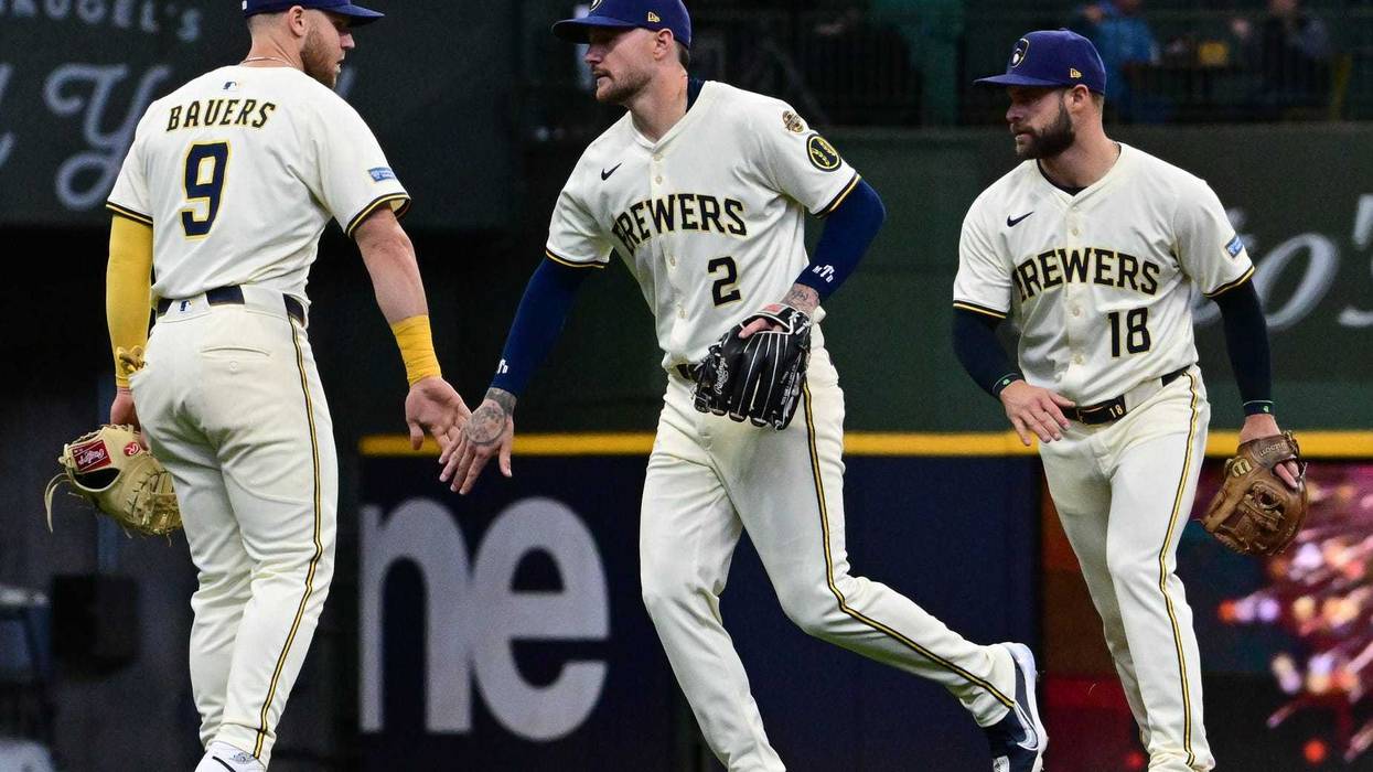 Apr 16, 2025; Milwaukee, Wisconsin, USA; Milwaukee Brewers first baseman Jake Bauers (9), second baseman Brice Turang (2) and third baseman Vinny Capra (18) celebrate after defeating the Detroit Tigers at American Family Field. Mandatory Credit: Benny Sieu-Imagn Images