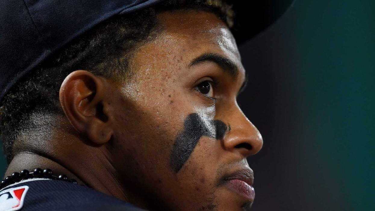 Apr 2, 2018; Anaheim, CA, USA; Cleveland Indians shortstop Francisco Lindor (12) looks on from the dugout during the game against the Los Angeles Angels at Angel Stadium of Anaheim.