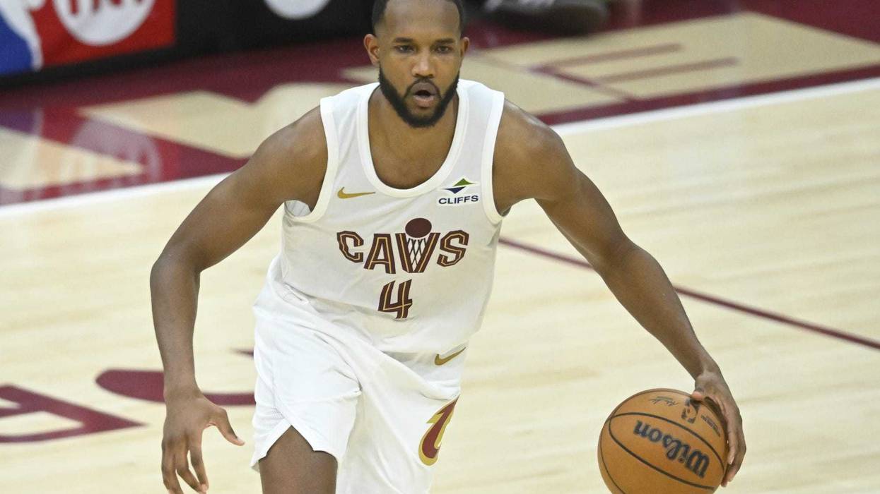 Apr 20, 2025; Cleveland, Ohio, USA; Cleveland Cavaliers forward Evan Mobley (4) dribbles the ball in the fourth quarter against the Miami Heat at Rocket Arena.
