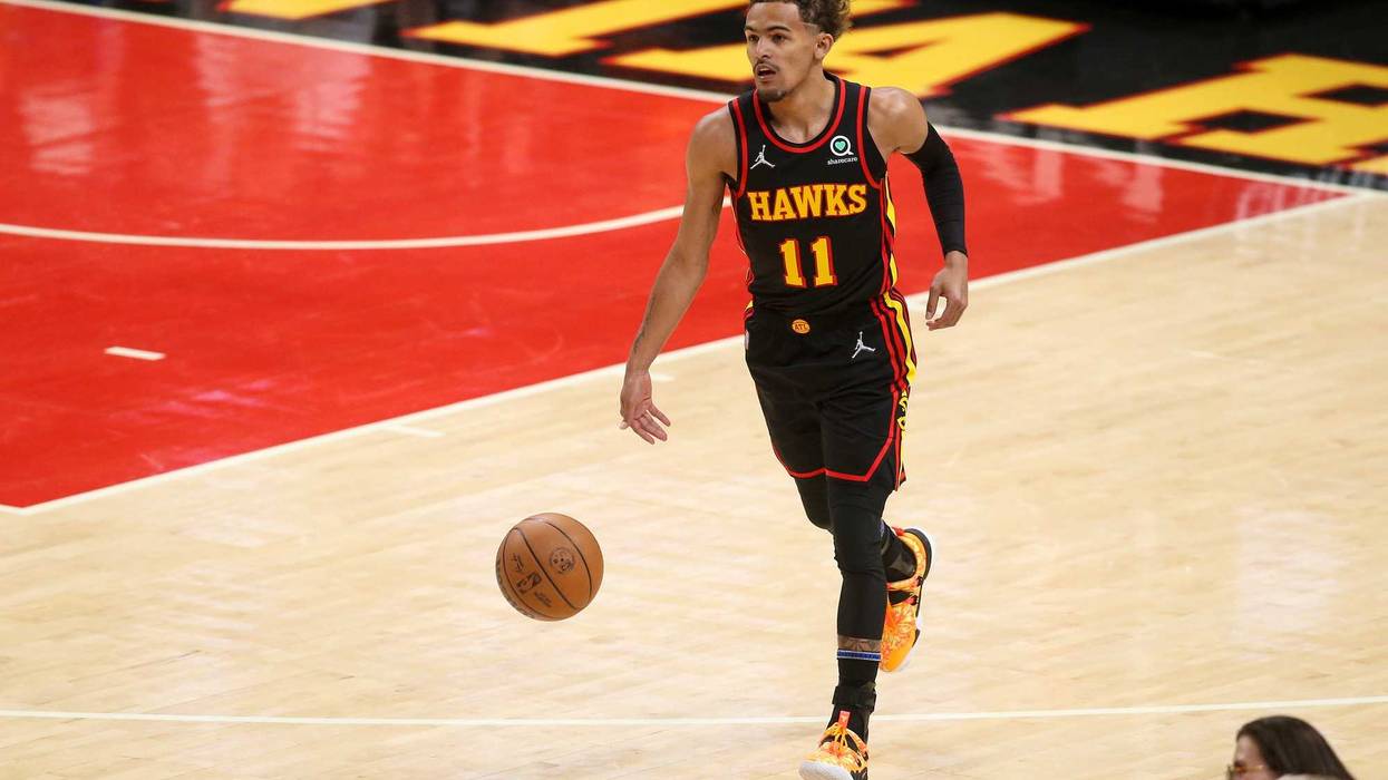 Apr 24, 2022; Atlanta, Georgia, USA; Atlanta Hawks guard Trae Young (11) dribbles against the Miami Heat in the first quarter during game four of the first round for the 2022 NBA playoffs at State Farm Arena.