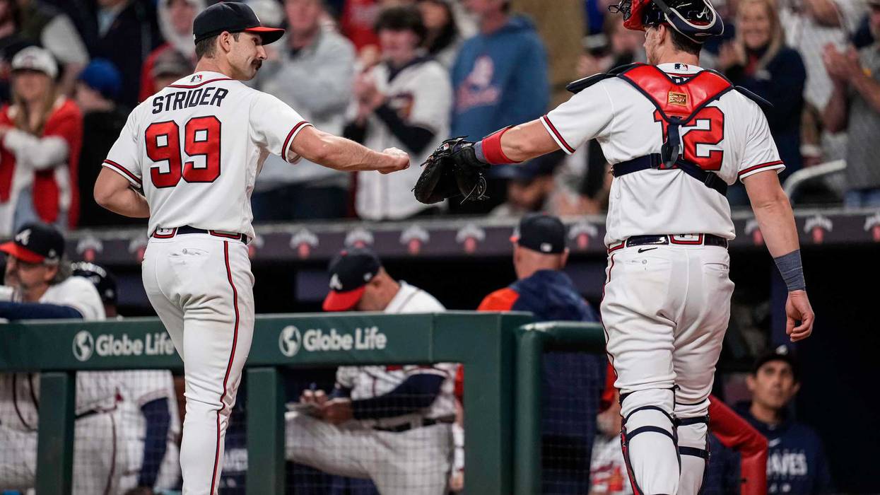 Apr 24, 2023; Cumberland, Georgia, USA; Atlanta Braves starting pitcher Spencer Strider (99) reacts with catcher Sean Murphy (12) after retiring the Miami Marlins during the eighth inning at Truist Park. Mandatory Credit: Dale Zanine-USA TODAY Sports