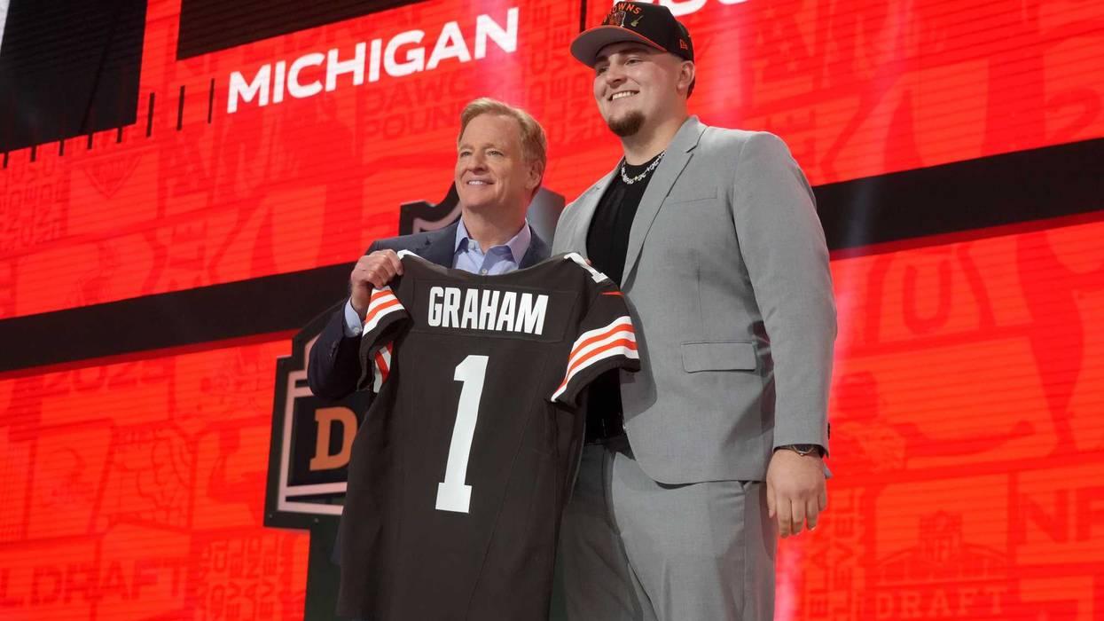 Apr 24, 2025; Green Bay, WI, USA; NFL commissioner Roger Goodell with Michigan Wolverines defensive lineman Mason Graham after he is selected by the Cleveland Browns as the number five pick in the first round of the 2025 NFL Draft at Lambeau Field.