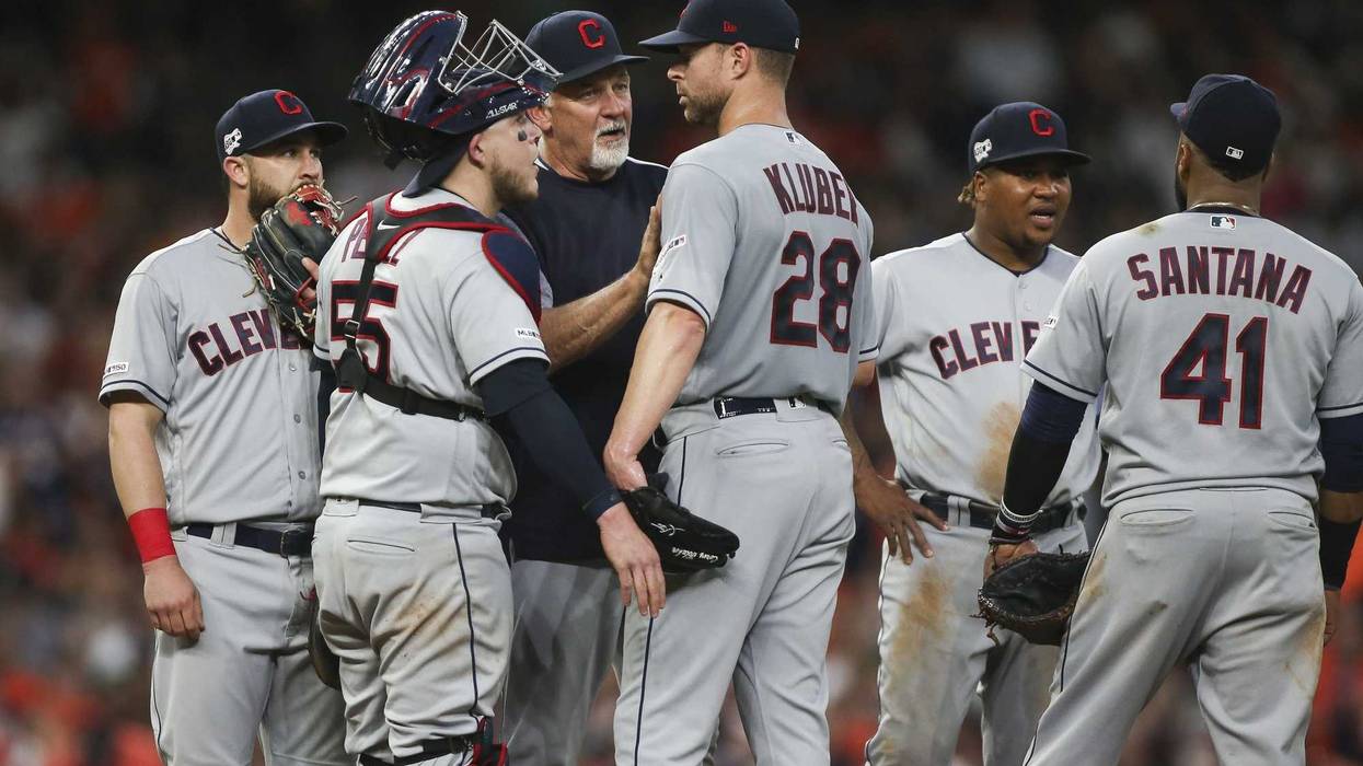 Apr 26, 2019; Houston, TX, USA; Cleveland Indians starting pitcher Corey Kluber (28) gets a mound visit from pitching coach Carl Willis (51) during the second inning against the Houston Astros at Minute Maid Park. Mandatory Credit: Troy Taormina-USA TODAY