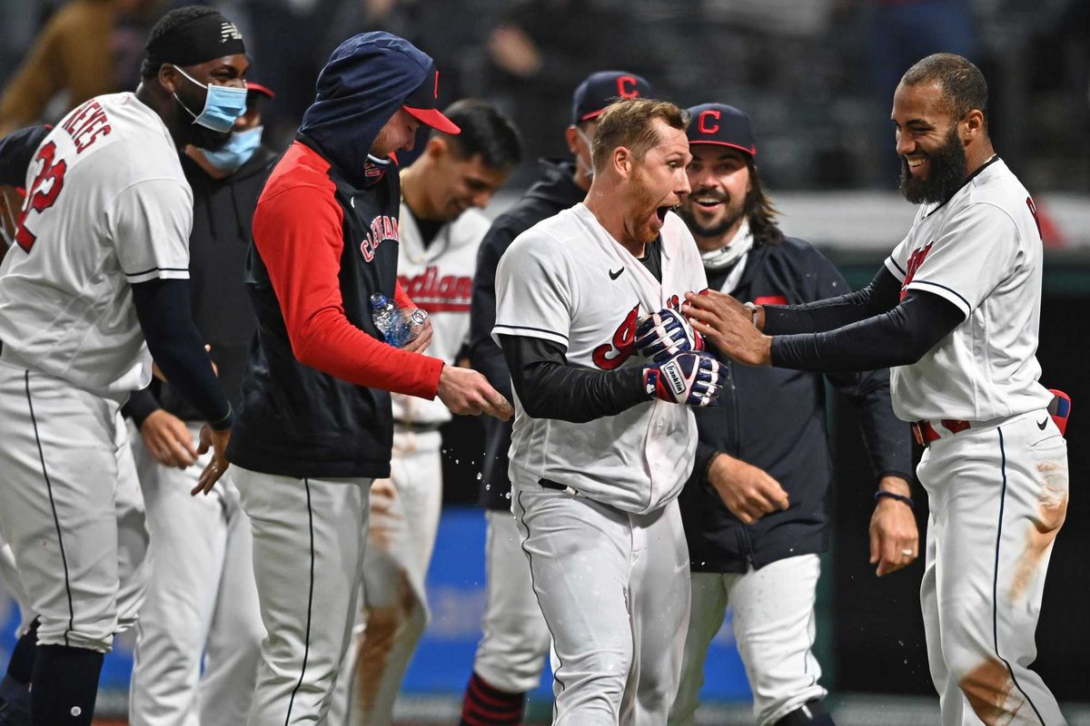 Apr 26, 2021; Cleveland, Ohio, USA; Cleveland Indians right fielder Jordan Luplow (center) reacts after being doused by his teammates after hitting a two-run walk-off home run against the Minnesota Twins at Progressive Field.