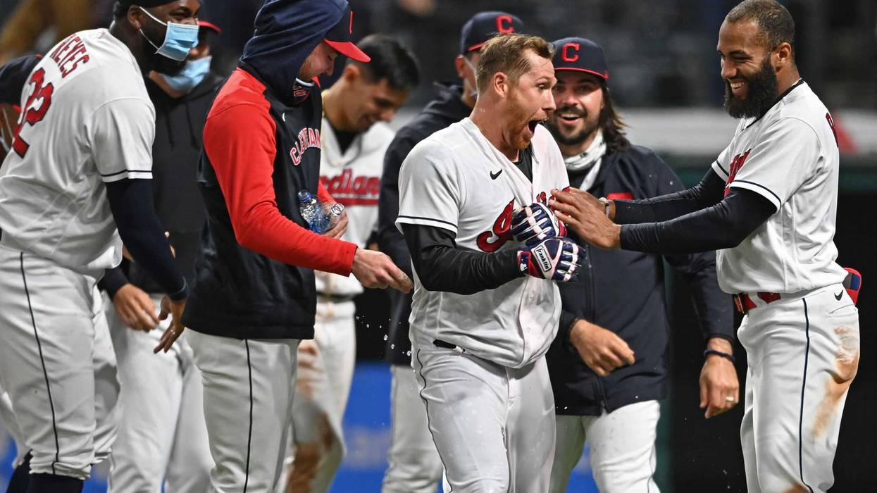 Apr 26, 2021; Cleveland, Ohio, USA; Cleveland Indians right fielder Jordan Luplow (center) reacts after being doused by his teammates after hitting a two-run walk-off home run against the Minnesota Twins at Progressive Field.