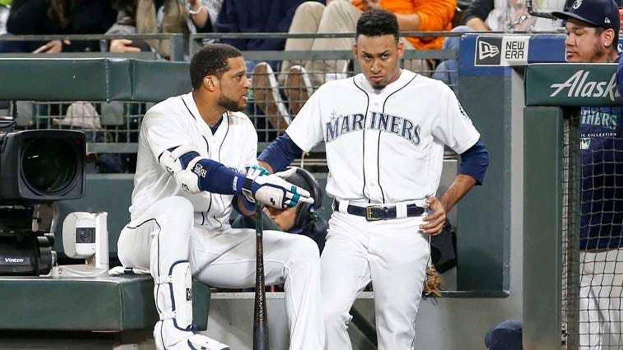 Apr 28, 2019; New York City, NY, USA; New York Mets second baseman Robinson Cano (24) is taken out of the game after getting hit by a pitch in the first inning against the Milwaukee Brewers at Citi Field. Mandatory Credit: Wendell Cruz-USA TODAY Sports