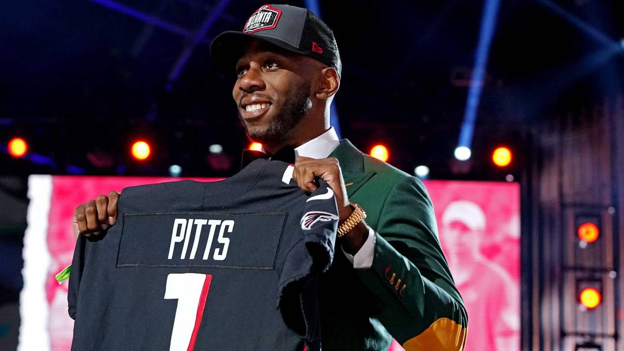 Apr 29, 2021; Cleveland, Ohio, USA; Kyle Pitts (Florida) poses with a jersey after being selected by Atlanta Falcons as the number four overall pick in the first round of the 2021 NFL Draft at First Energy Stadium. Mandatory Credit: Kirby Lee-Imagn Images