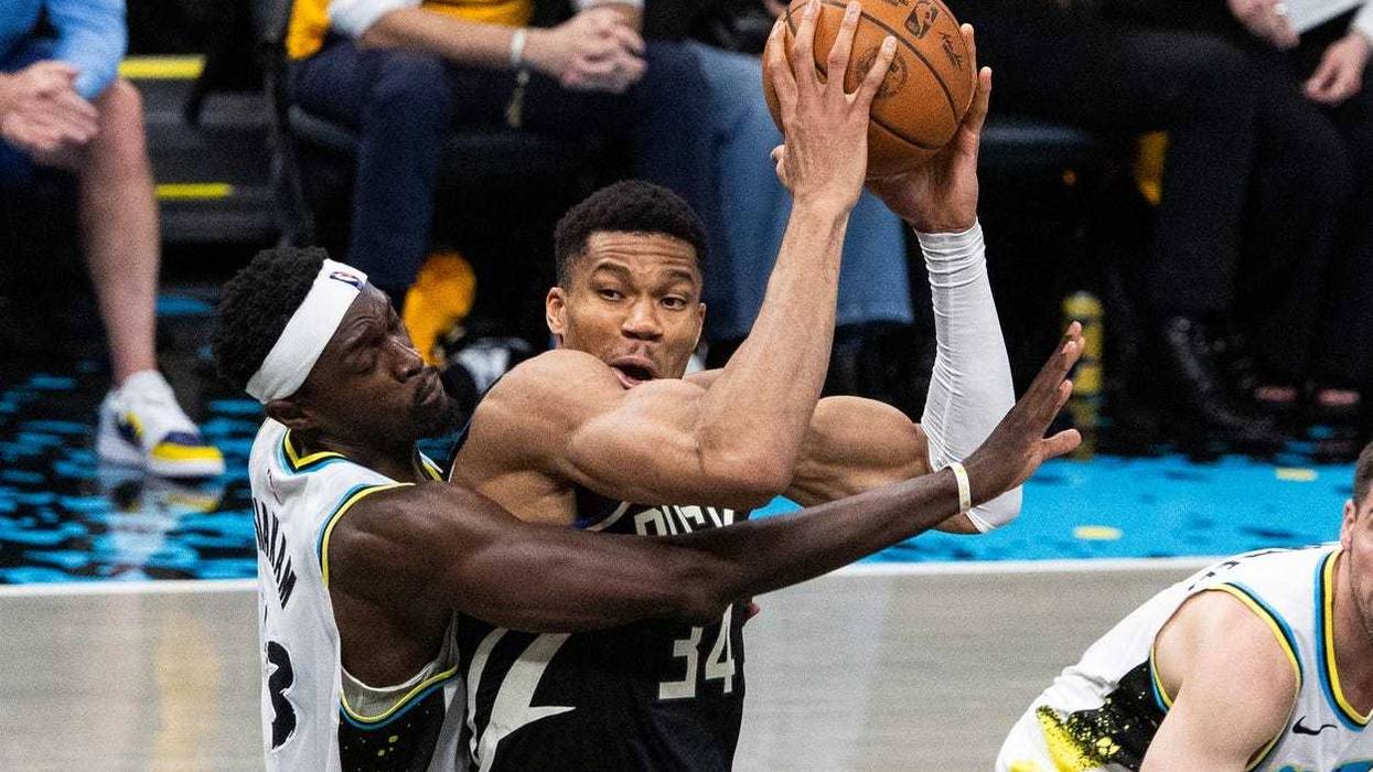 Apr 29, 2025; Indianapolis, Indiana, USA; Milwaukee Bucks forward Giannis Antetokounmpo (34) shoots the ball while Indiana Pacers forward Pascal Siakam (43) defends during game five of the first round for the 2024 NBA Playoffs at Gainbridge Fieldhouse. Mandatory Credit: Trevor Ruszkowski-Imagn Images