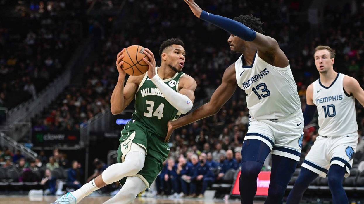 Apr 3, 2024; Milwaukee, Wisconsin, USA; Milwaukee Bucks forward Giannis Antetokounmpo (34) drives for the basket against Memphis Grizzlies forward Jaren Jackson Jr. (13) in the third quarter at Fiserv Forum. Mandatory Credit: Benny Sieu-Imagn Images