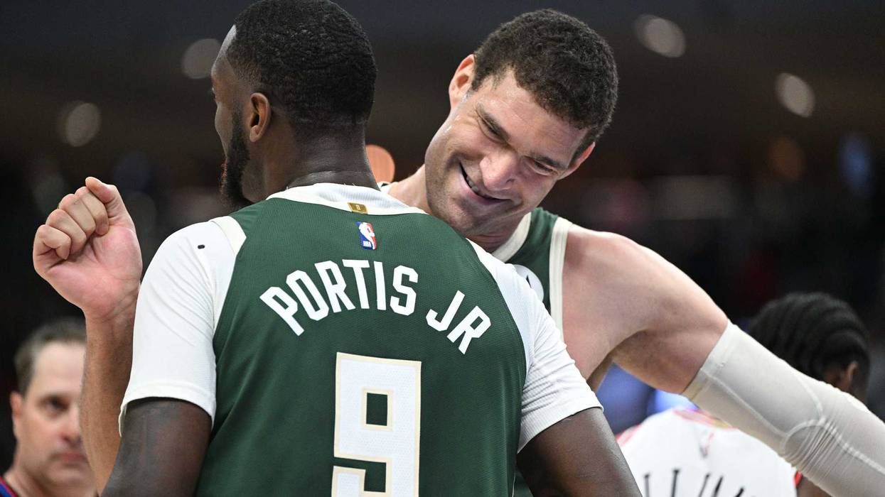 Apr 5, 2023; Milwaukee, Wisconsin, USA; Milwaukee Bucks center Brook Lopez (11) celebrates with forward Bobby Portis (9) against the Chicago Bulls at Fiserv Forum. Mandatory Credit: Michael McLoone-USA TODAY Sports