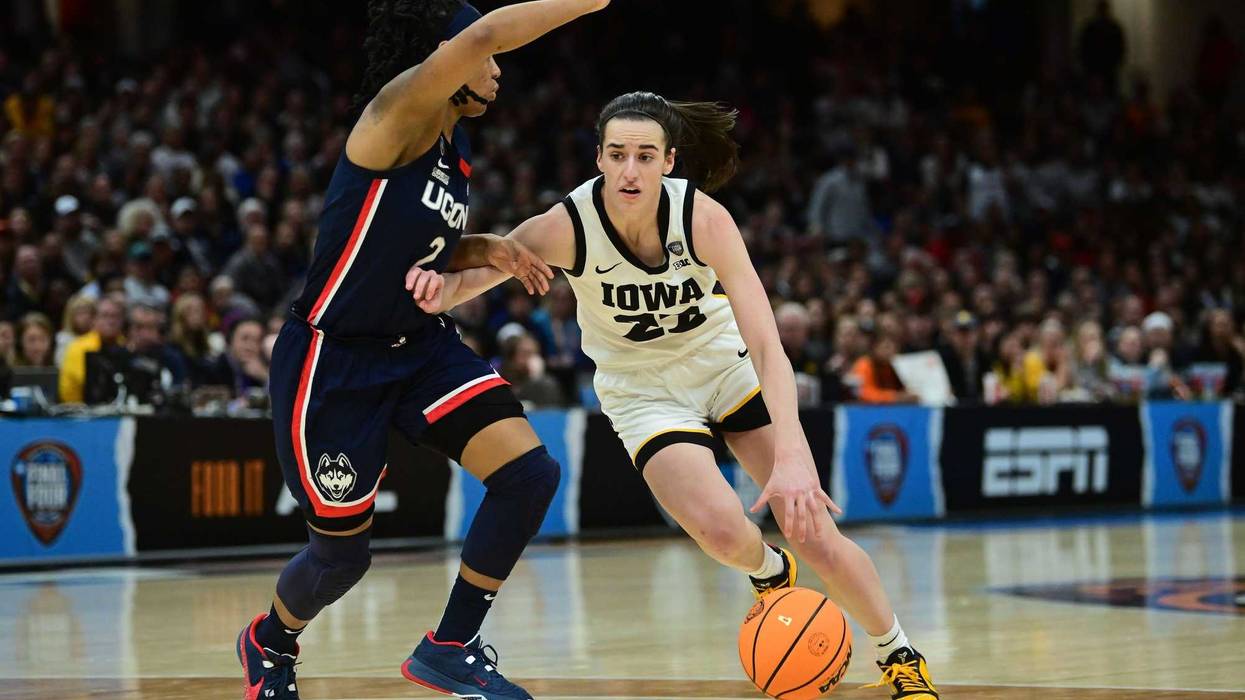 Apr 5, 2024; Cleveland, OH, USA; Iowa Hawkeyes guard Caitlin Clark (22) dribbles the ball against Connecticut Huskies guard KK Arnold (2) in the semifinals of the Final Four of the womens 2024 NCAA Tournament at Rocket Mortgage FieldHouse. Mandatory Credit: Ken Blaze-USA TODAY Sports