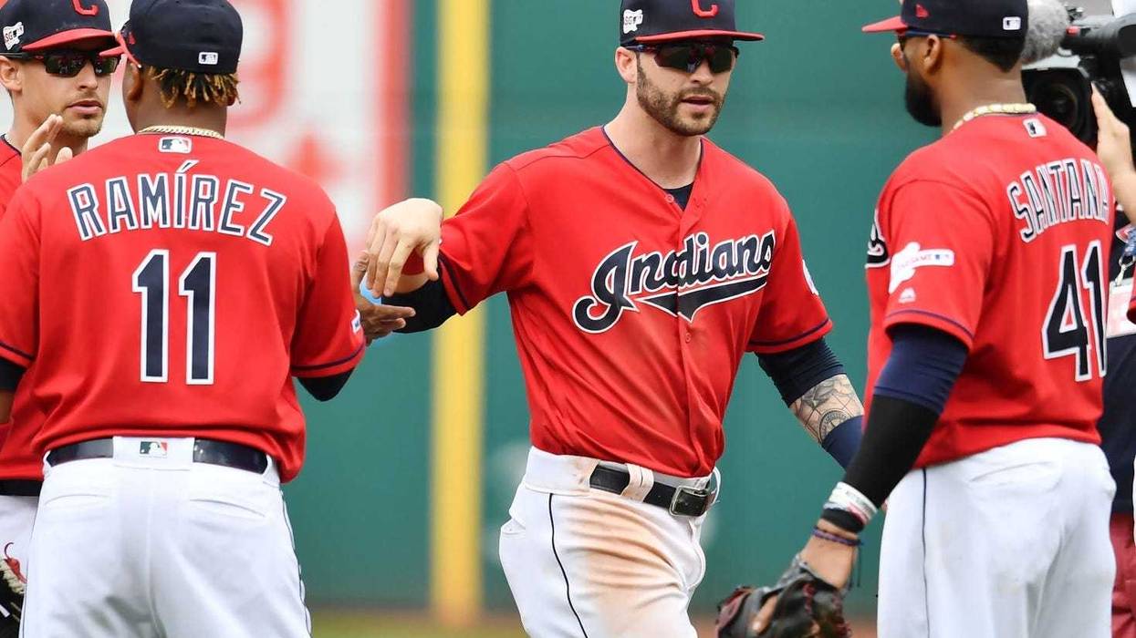 Apr 7, 2019; Cleveland, OH, USA; Cleveland Indians third baseman Jose Ramirez (11) and right fielder Tyler Naquin (center) and first baseman Carlos Santana (41) celebrate after the Indians defeated the Toronto Blue Jays at Progressive Field.