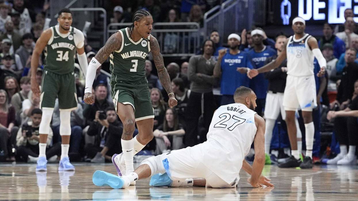 Apr 8, 2025; Milwaukee, Wisconsin, USA; Milwaukee Bucks guard Kevin Porter Jr. (3) and Minnesota Timberwolves center Rudy Gobert (27) in an altercation during the second half at Fiserv Forum. Mandatory Credit: Michael McLoone-Imagn Images