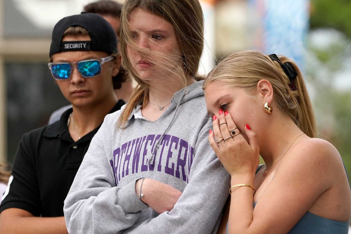 APTOPIX Shooting July Fourth Parade