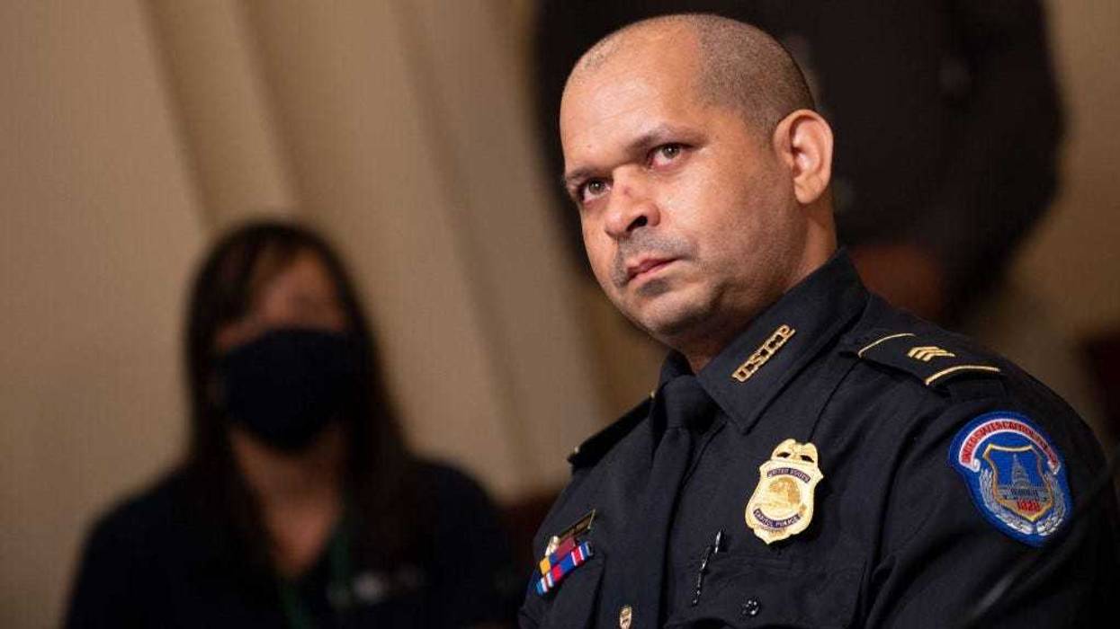 Aquilino Gonell, sergeant of the U.S. Capitol Police, watches a video of rioters during a hearing of the House select committee investigating the January 6 attack on the U.S. Capitol on July 27, 2021 at the Cannon House Office Building in Washington, DC.