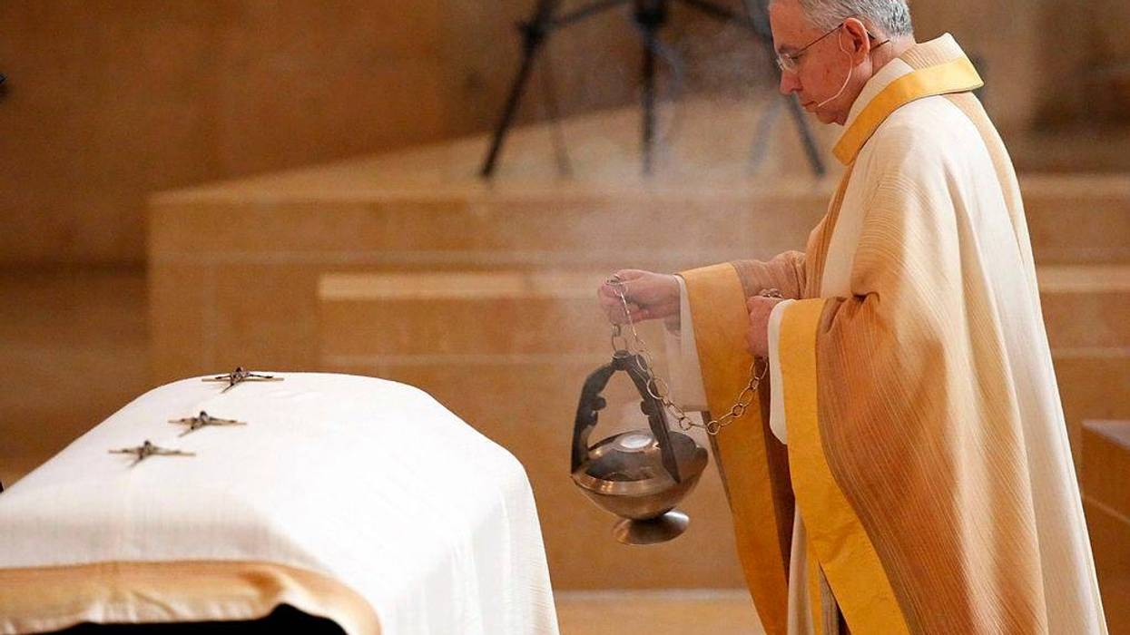 Archbishop Jose Gomez blesses the casket of LAPD officer Nicholas Lee as hundreds of fellow officers gathered at the Cathedral of Our Lady of the Angels on March 13, 2014 in Los Angeles, California.