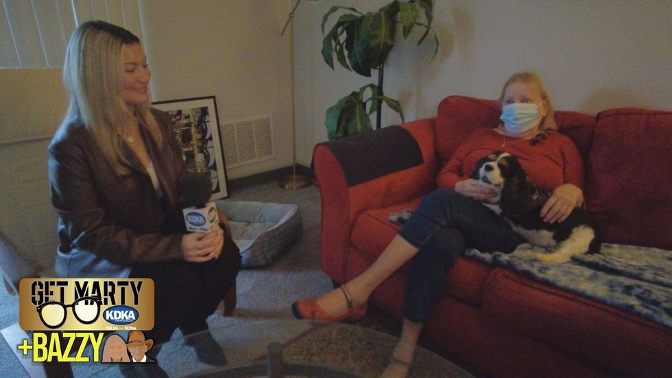 Arianna Bazzy talks to Carol inside the apartment she