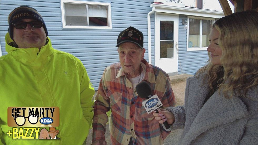 Arianna Bazzy talks to WWII veteran Dominico Charidi and Carlos McClintock from Greater Pitt Tree Service.
